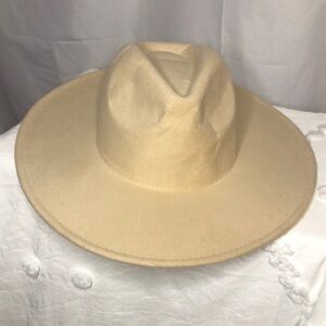 Cream colored felt wide brimmed hat. No size listed.